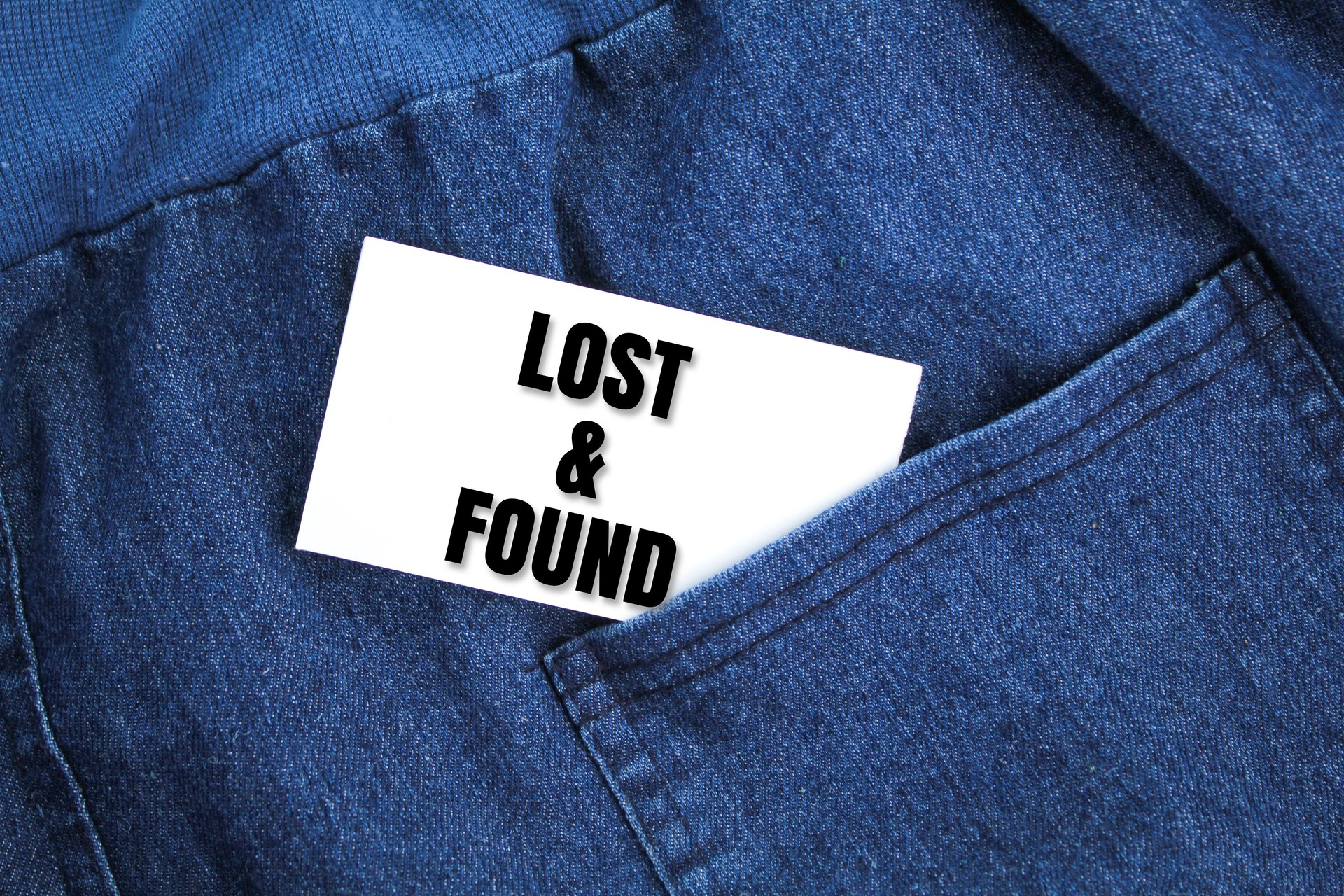 cloth and white paper with the words lost found. the concept of lost and found. looking for something valuable