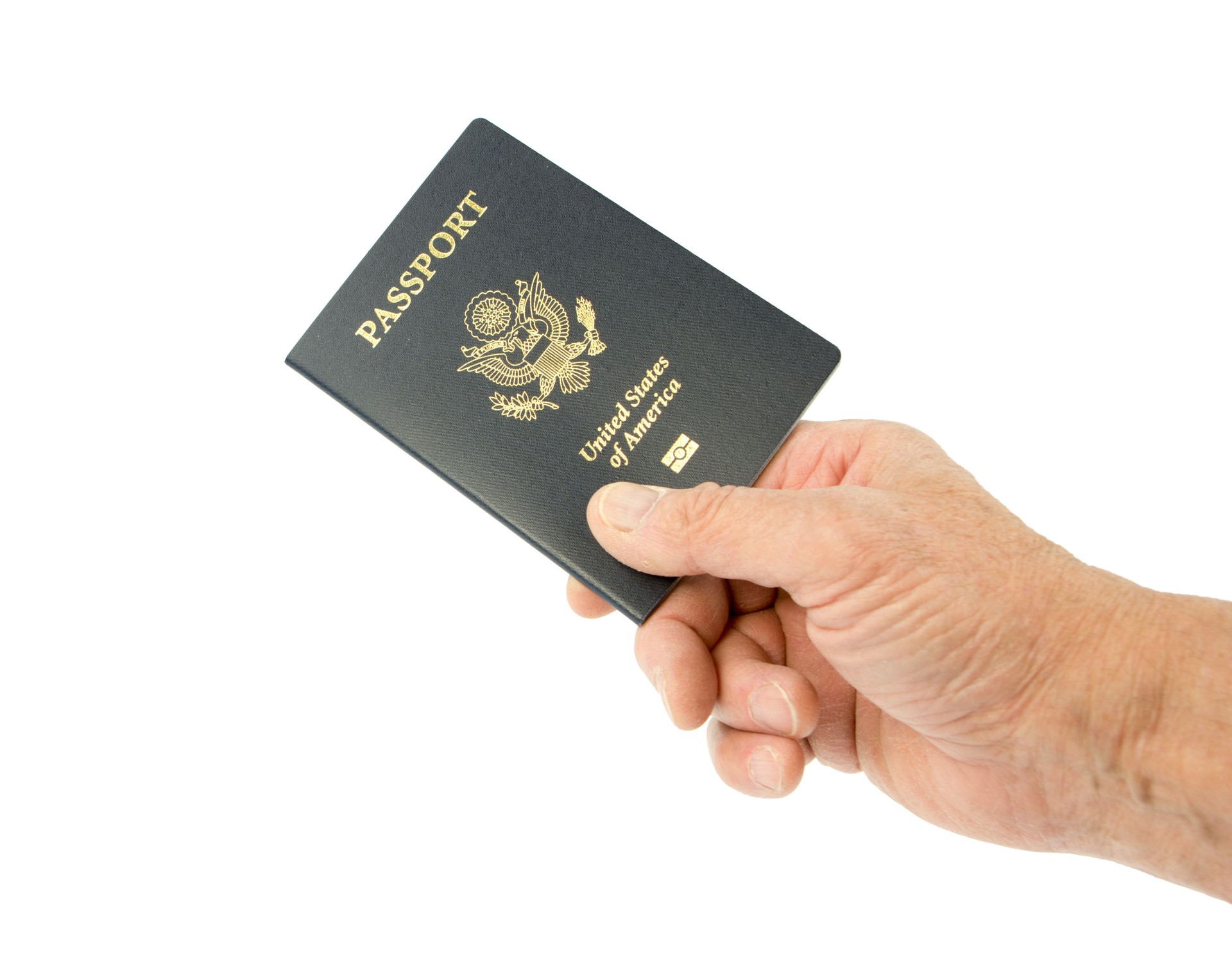 United States passport hand held with a clipping path