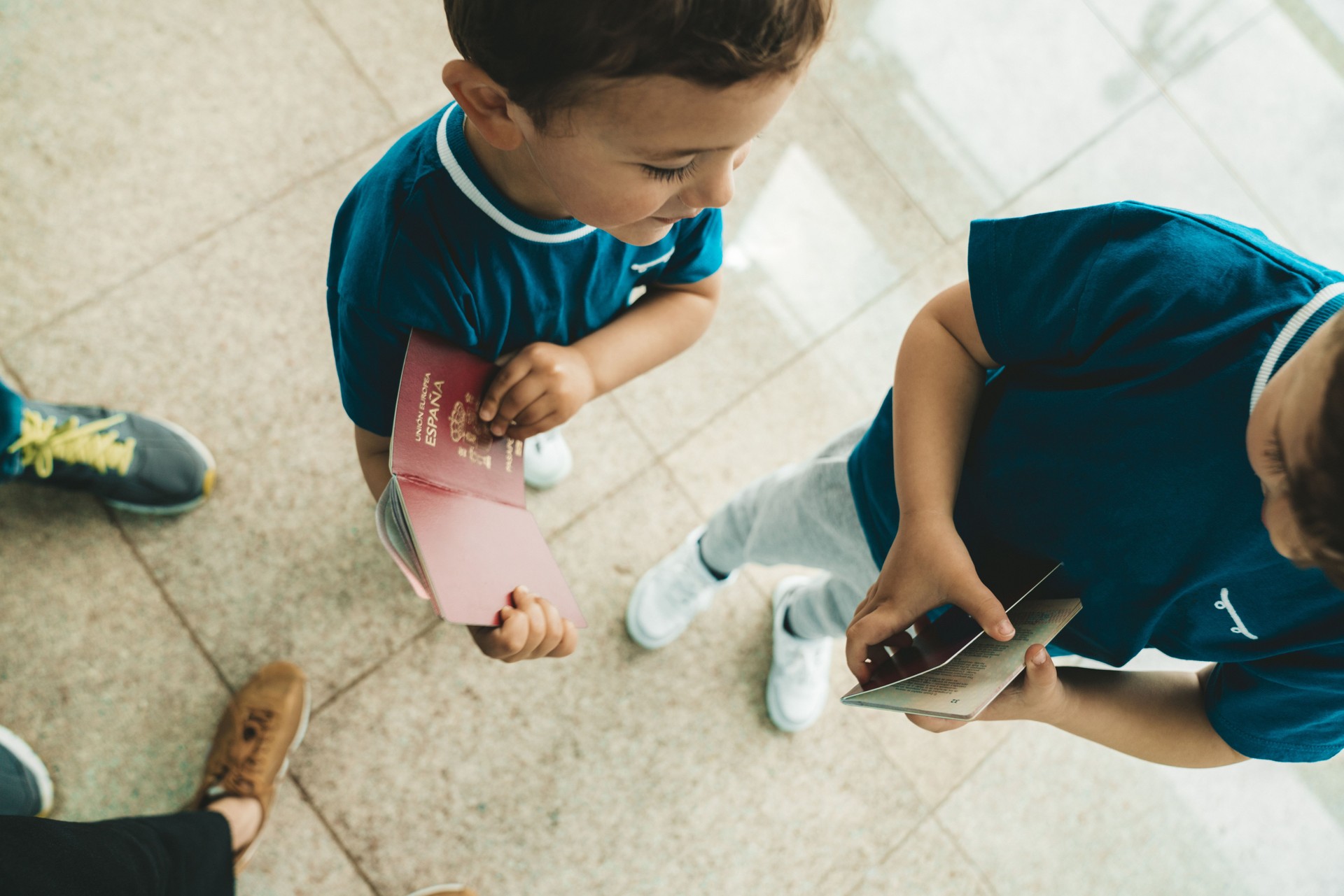 Children holding passport at the airport